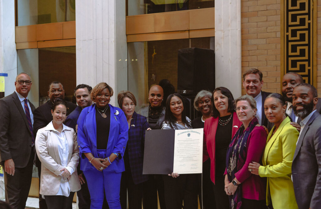 Congresswoman Ayanna Pressley and other legislators pictured with staff and leadership of the Louis D. Brown Peace Institute at the Massachusetts State House in 2023.
